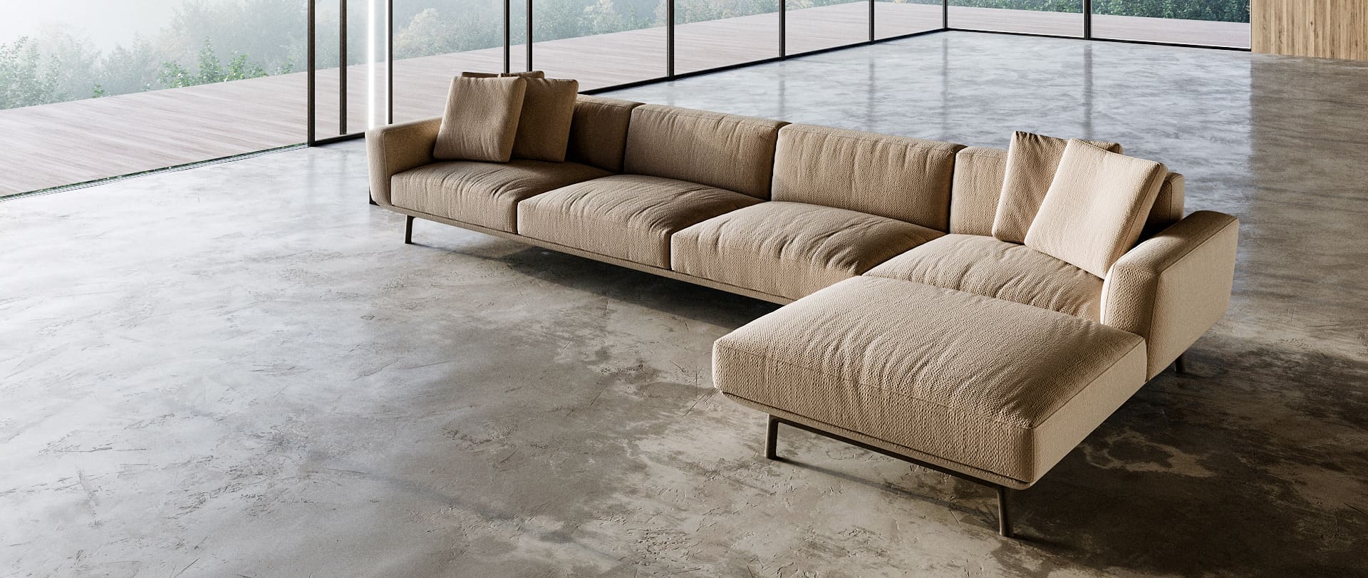 A spacious living room with a beige sectional sofa, large windows, and a concrete floor, offering a view of the outdoors. This illustrates the benefits of 3D product visualization in presenting furniture in a realistic setting, helping customers visualize how it will look in their space.